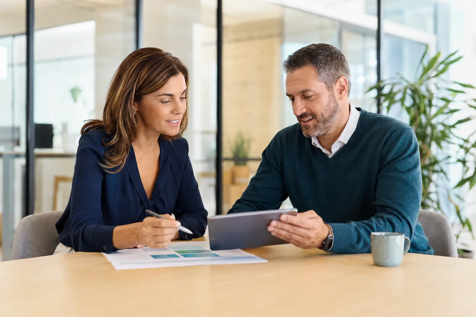 Two professionals planning a corporate wellbeing programme together
